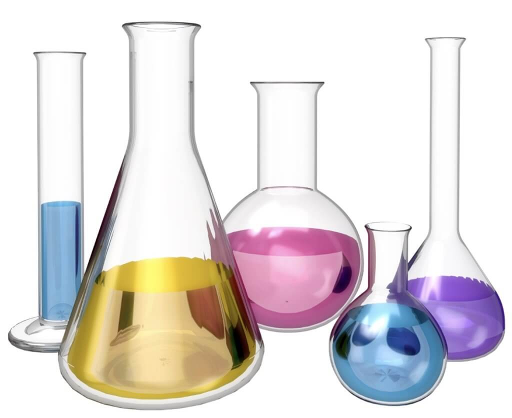 Glass science beakers linked up containing colorful liquid